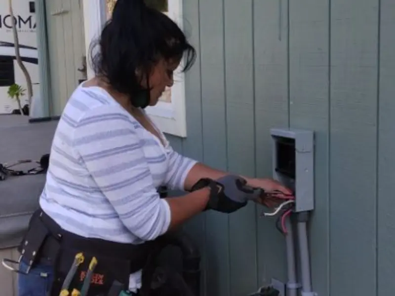 Licensed electrician wiring an exterior subpanel in Channahon