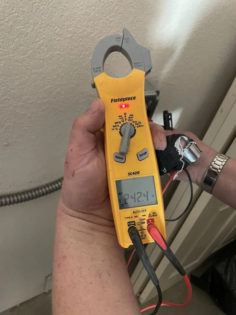 Voltage testing with clamp meter during Outlet Installation in Channahon